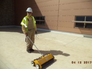 Roof inspection photo showing moisture survey in progress