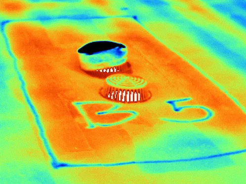 Infrared thermal image of a home showing heat loss